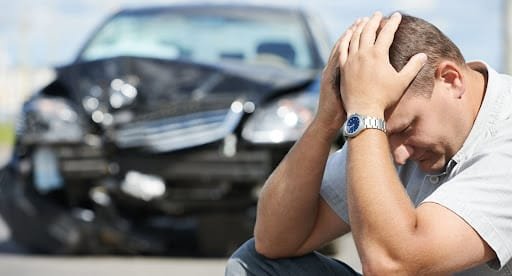 A happy family standing in front of their car, showcasing reliable auto insurance services offered by Insurance Company Powell Ohio LLC.