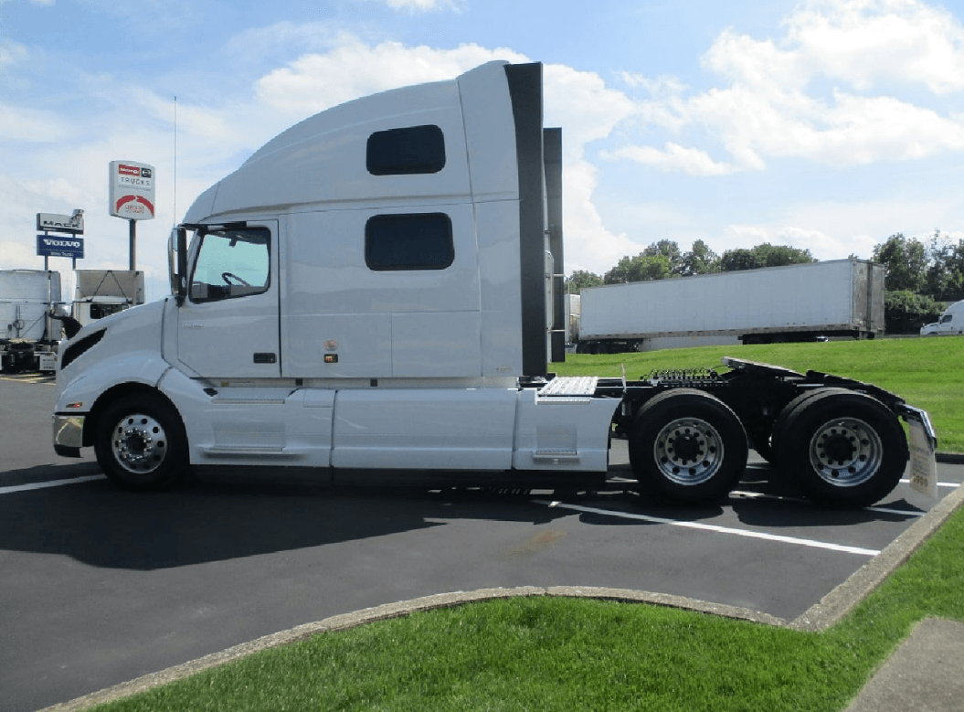 a semi-truck driving on a highway, representing comprehensive semi-truck insurance services offered by Insurance Company Powell Ohio LLC, ensuring coverage and protection for transportation businesses.