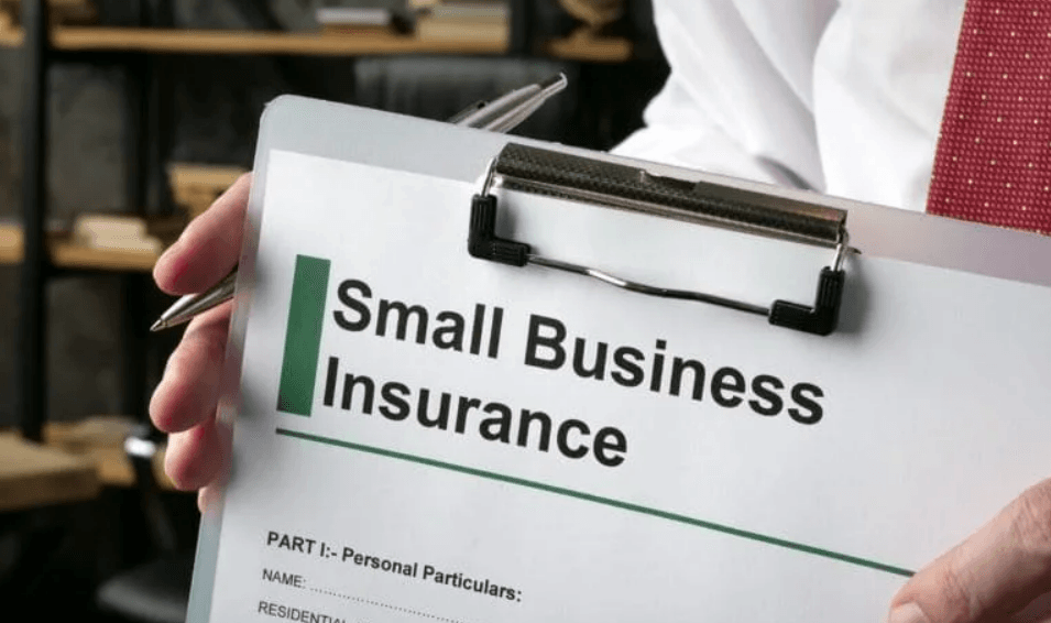 A professional insurance agent from Insurance Company Powell, Ohio, discussing customized insurance solutions with a small business owner in a modern office setting.