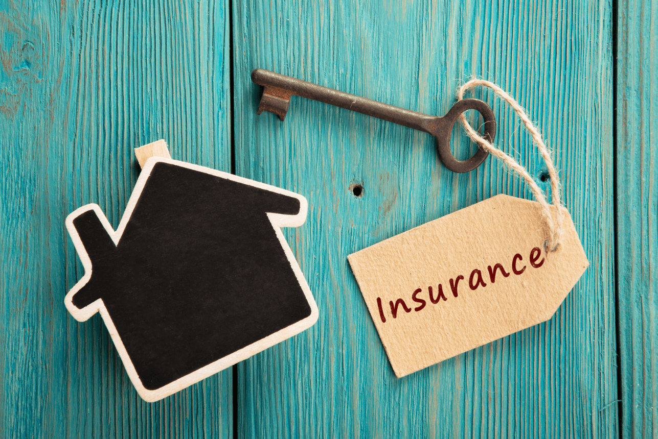 a professional insurance agent discussing landlord policies with a client in an office setting; the client appears engaged and taking notes, representing the comprehensive and personalized service offered by Insurance Company Powell, Ohio, LLC.